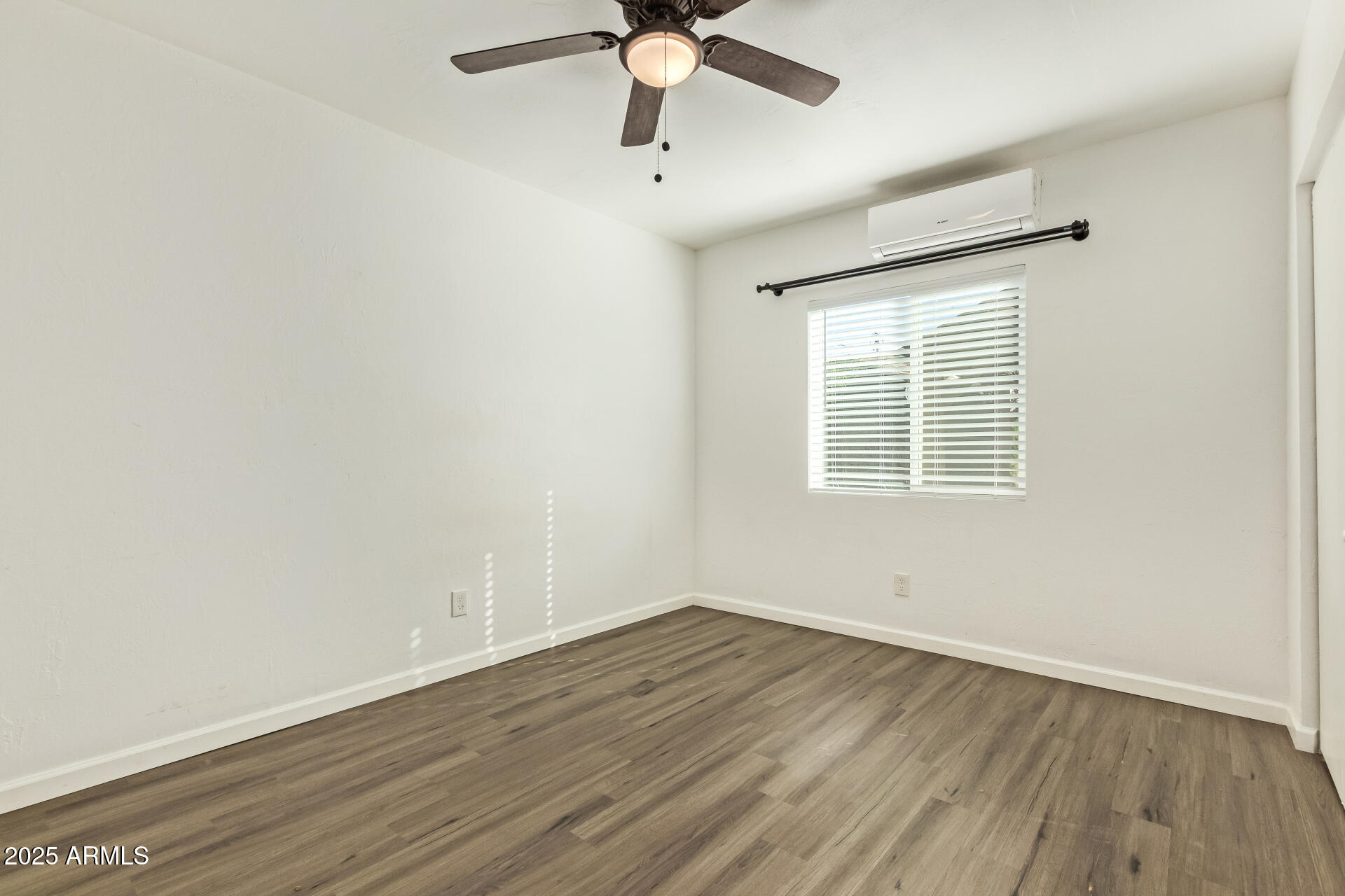 336 Virginia Avenue Phoenix, AZ 85003 - Photo 26 of 29 wooden floor in an empty room with a window