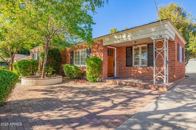 a view of a house with a garden