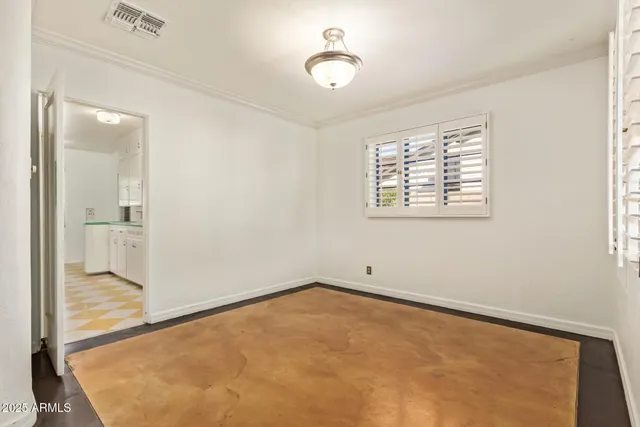 an empty room with windows and entrance