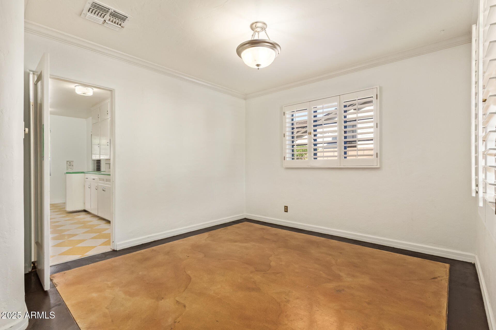 336 Virginia Avenue Phoenix, AZ 85003 - Photo 5 of 29 an empty room with windows and entrance