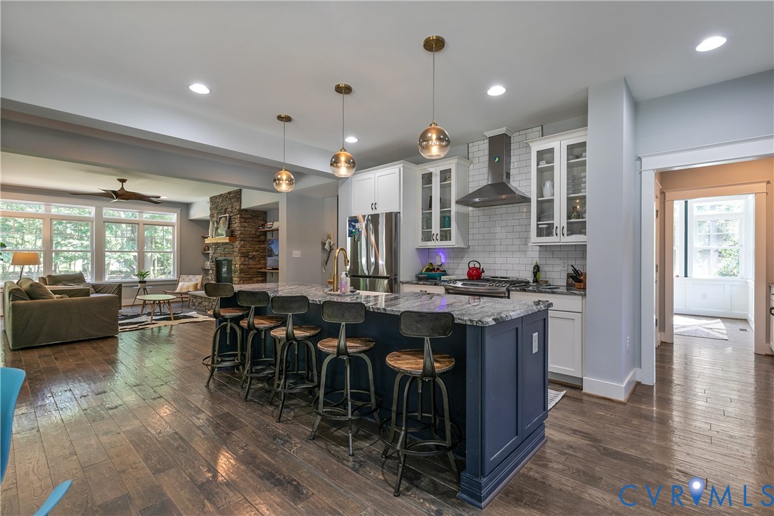 9749 Hoke Brady Road Henrico, VA 23231 - Photo 12 of 53 an open kitchen with kitchen island a sink and a stove top oven