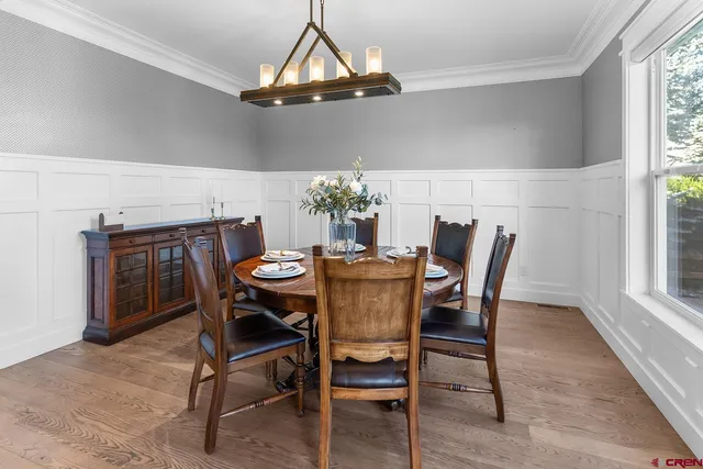 a spacious bedroom with a bed a couch and a dresser in it