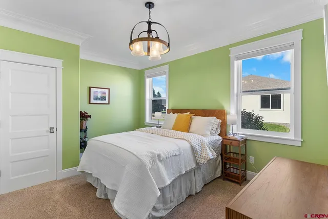 a bathroom with a granite countertop sink toilet a mirror and shower
