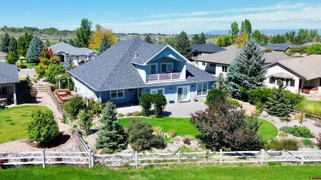 a aerial view of a house with yard swimming pool and outdoor seating