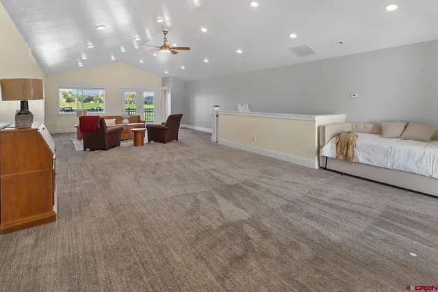 a hallway with furniture and wooden floor