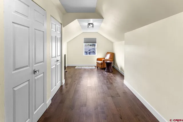 a view of a house with wooden floor and windows