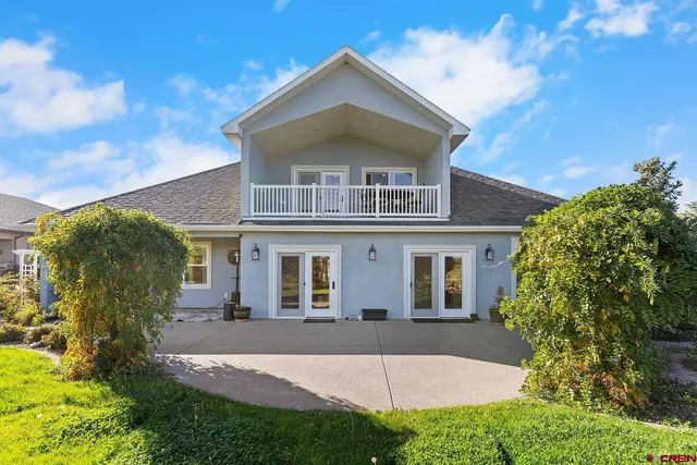 a view of a backyard with sitting area