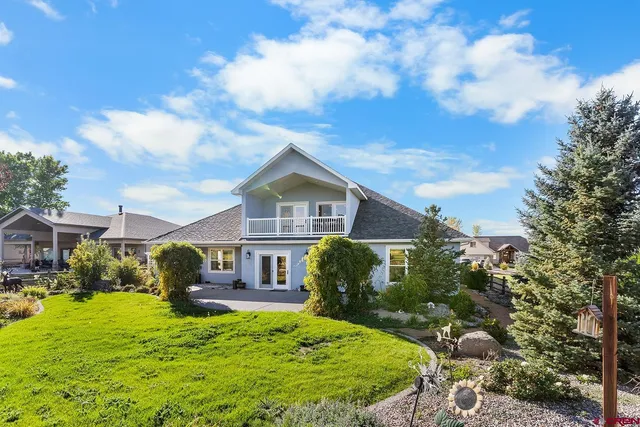 a view of a lake with a house in the background