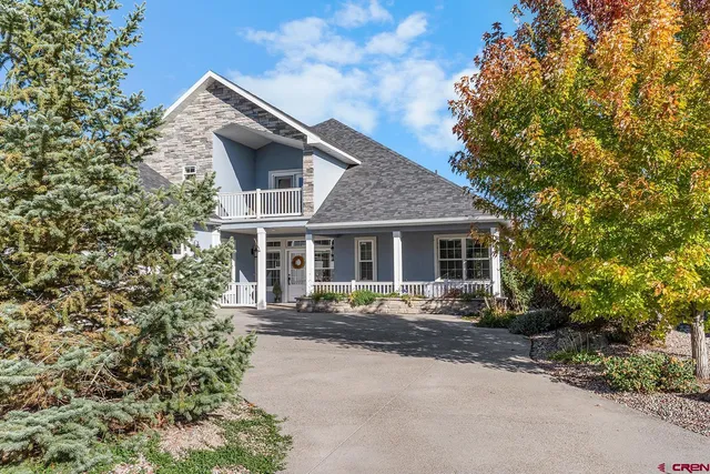 an aerial view of multiple houses with yard