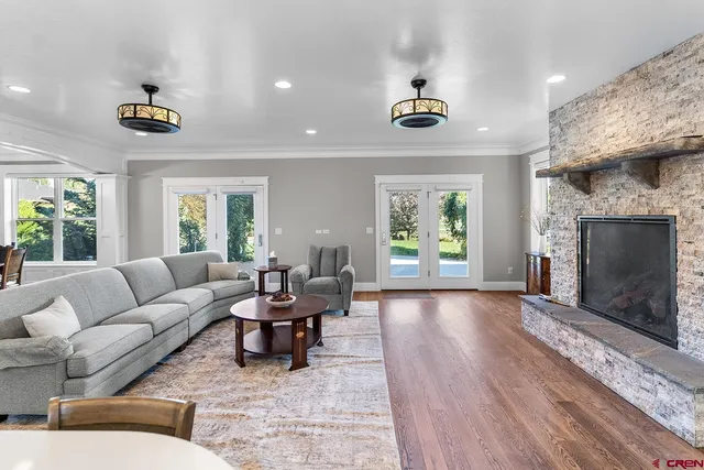 a living room with furniture and a fireplace