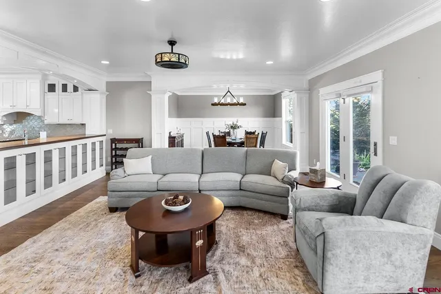 a living room with furniture and a large window