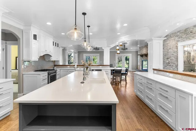 a view of a dining room with furniture and window