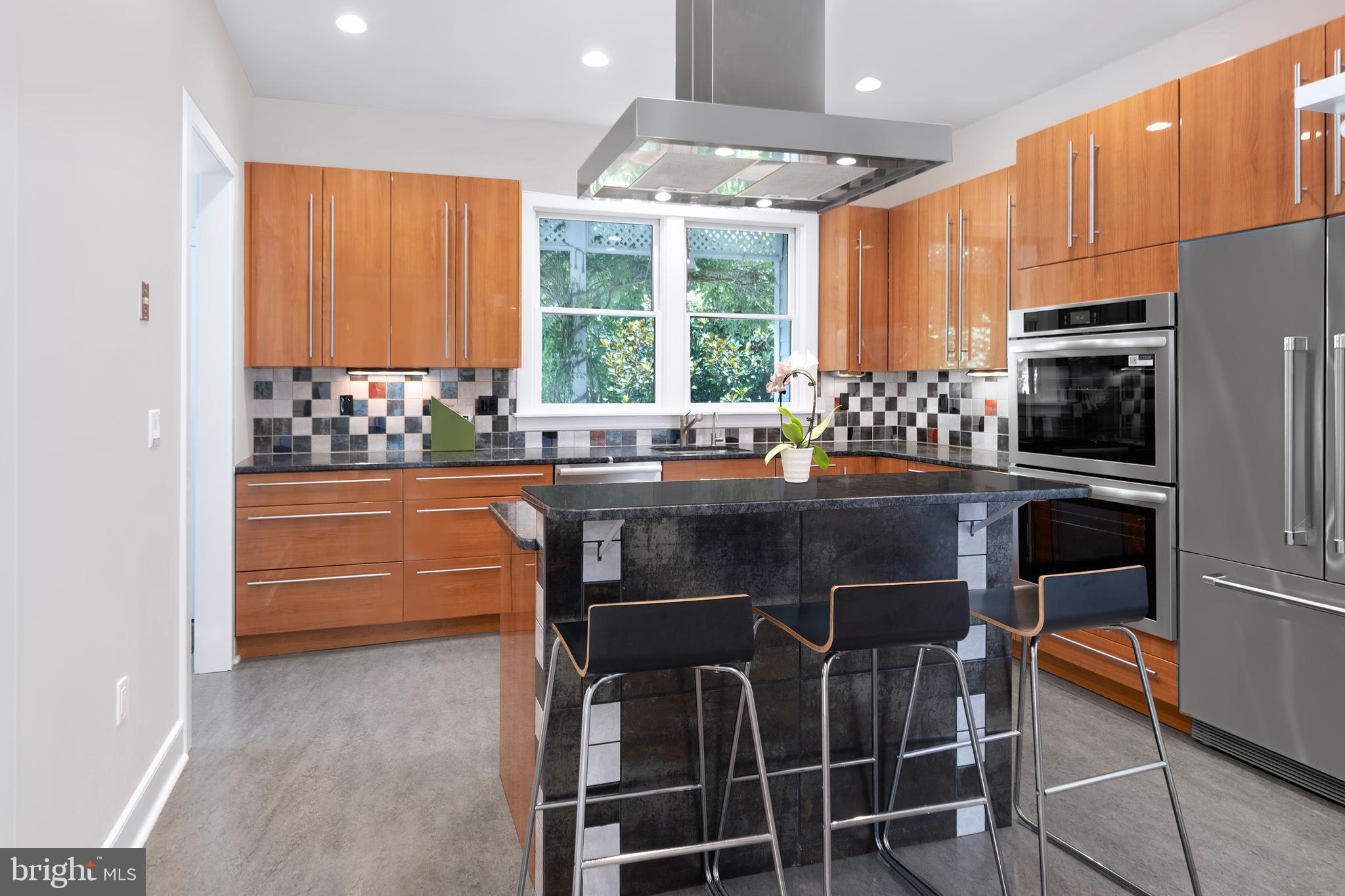 44 Wiggins Street Princeton, NJ 08540 - Photo 14 of 41 a kitchen with stainless steel appliances a stove a refrigerator and a dining table