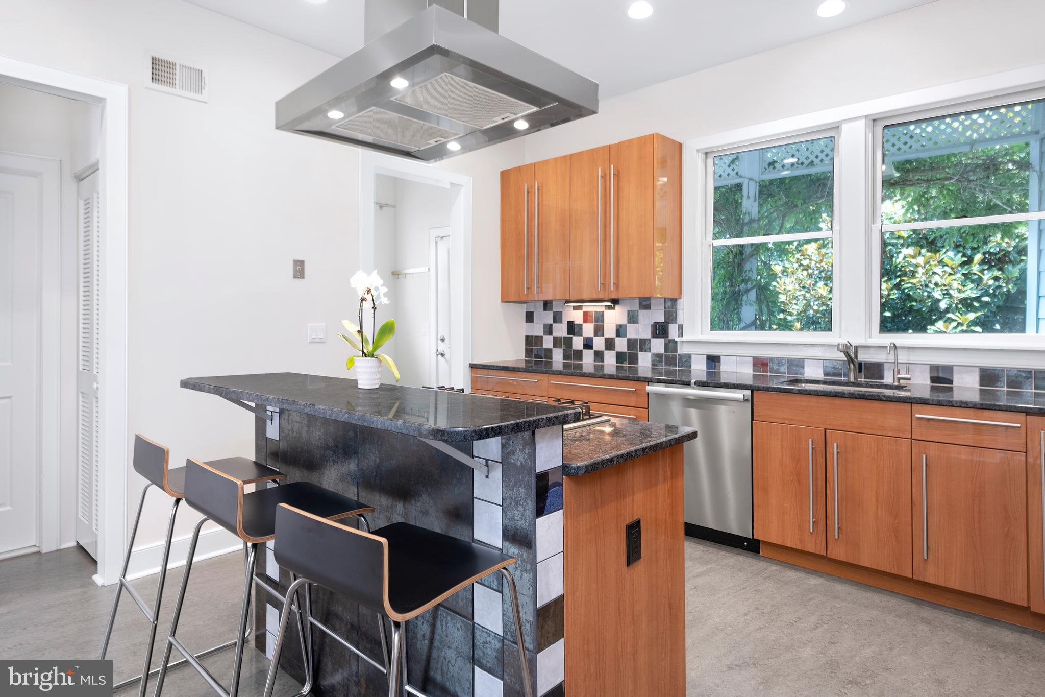 44 Wiggins Street Princeton, NJ 08540 - Photo 16 of 41 a kitchen with a table chairs sink and wooden floor