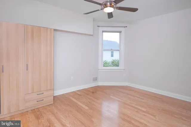 a view of front door with wooden floor