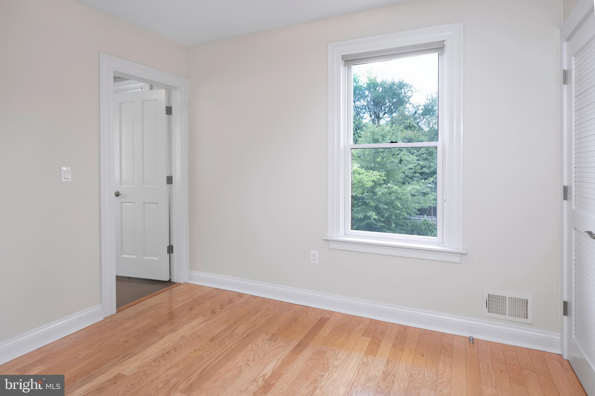 44 Wiggins Street Princeton, NJ 08540 - Photo 23 of 41 an empty room with a window and wooden floor