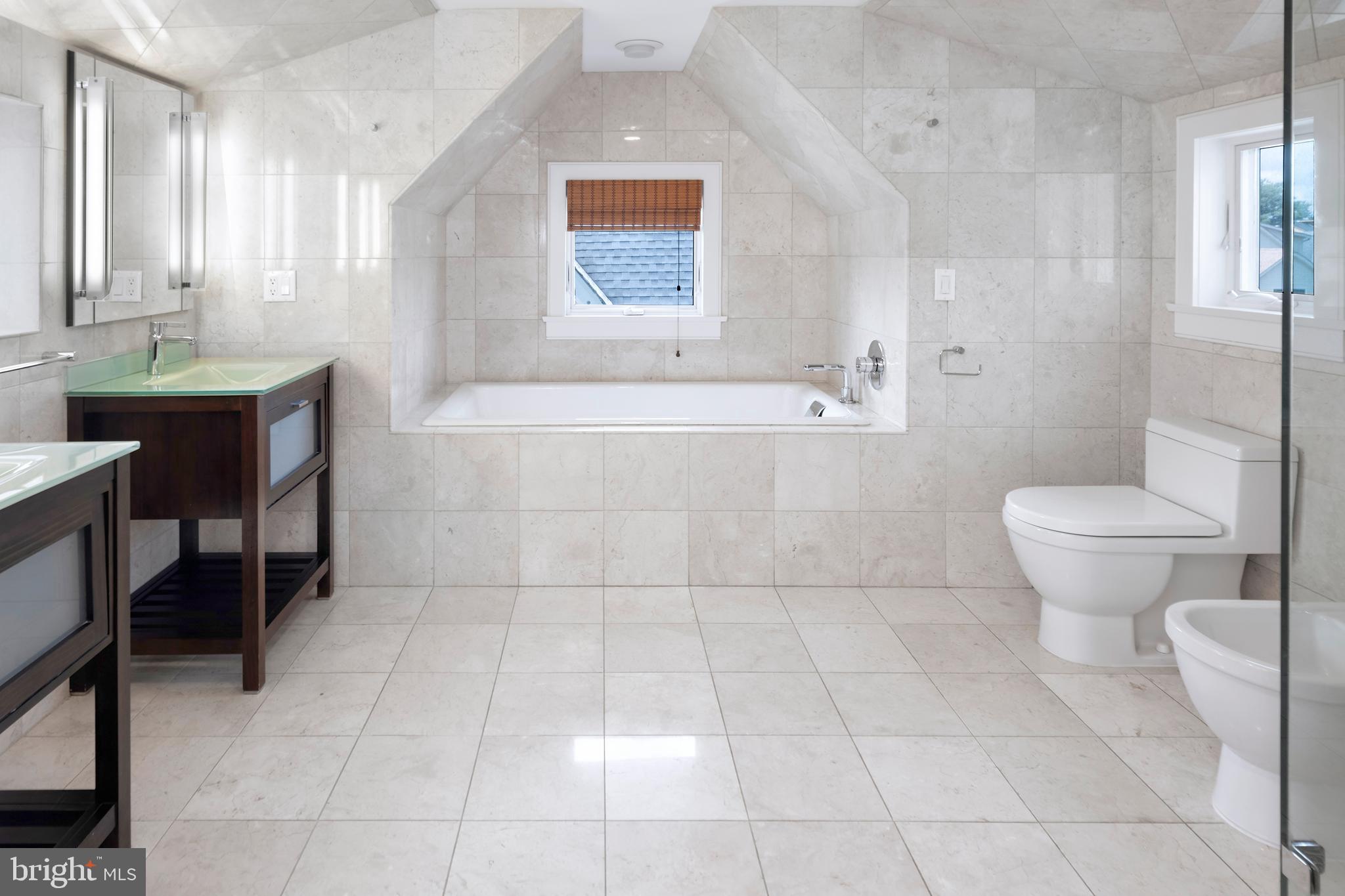 44 Wiggins Street Princeton, NJ 08540 - Photo 32 of 41 a bathroom with a granite countertop sink a toilet a mirror and shower