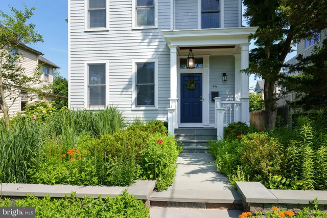 a view of a house with balcony and garden