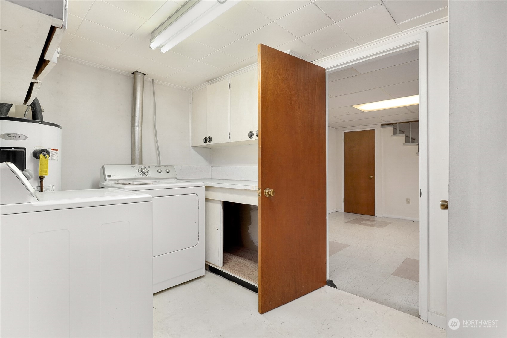 14624 Southeast Allen Rd. Bellevue, WA 98006 - Photo 21 of 26 a utility room with cabinets washer and dryer