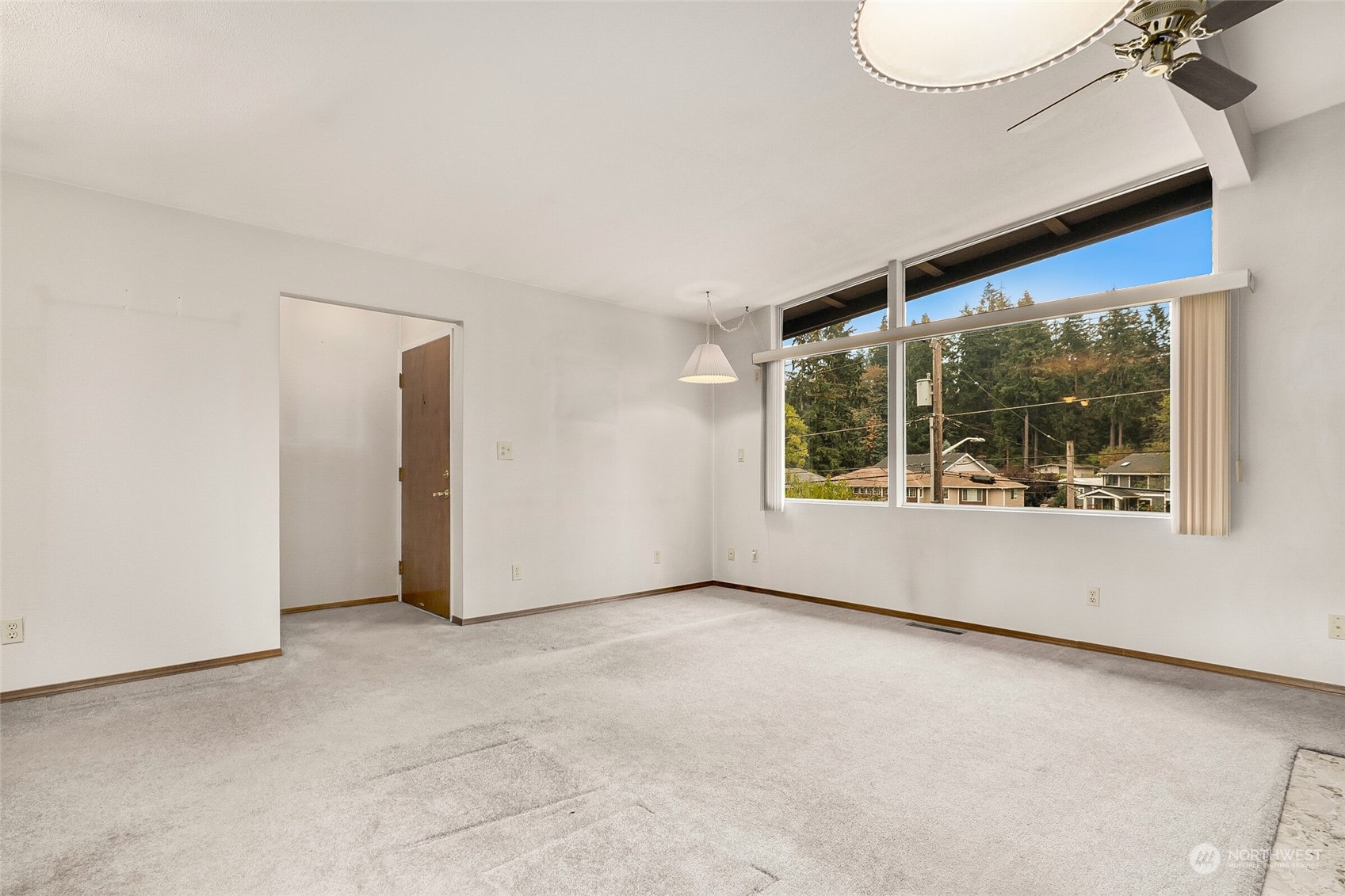 14624 Southeast Allen Rd. Bellevue, WA 98006 - Photo 3 of 26 an empty room with windows