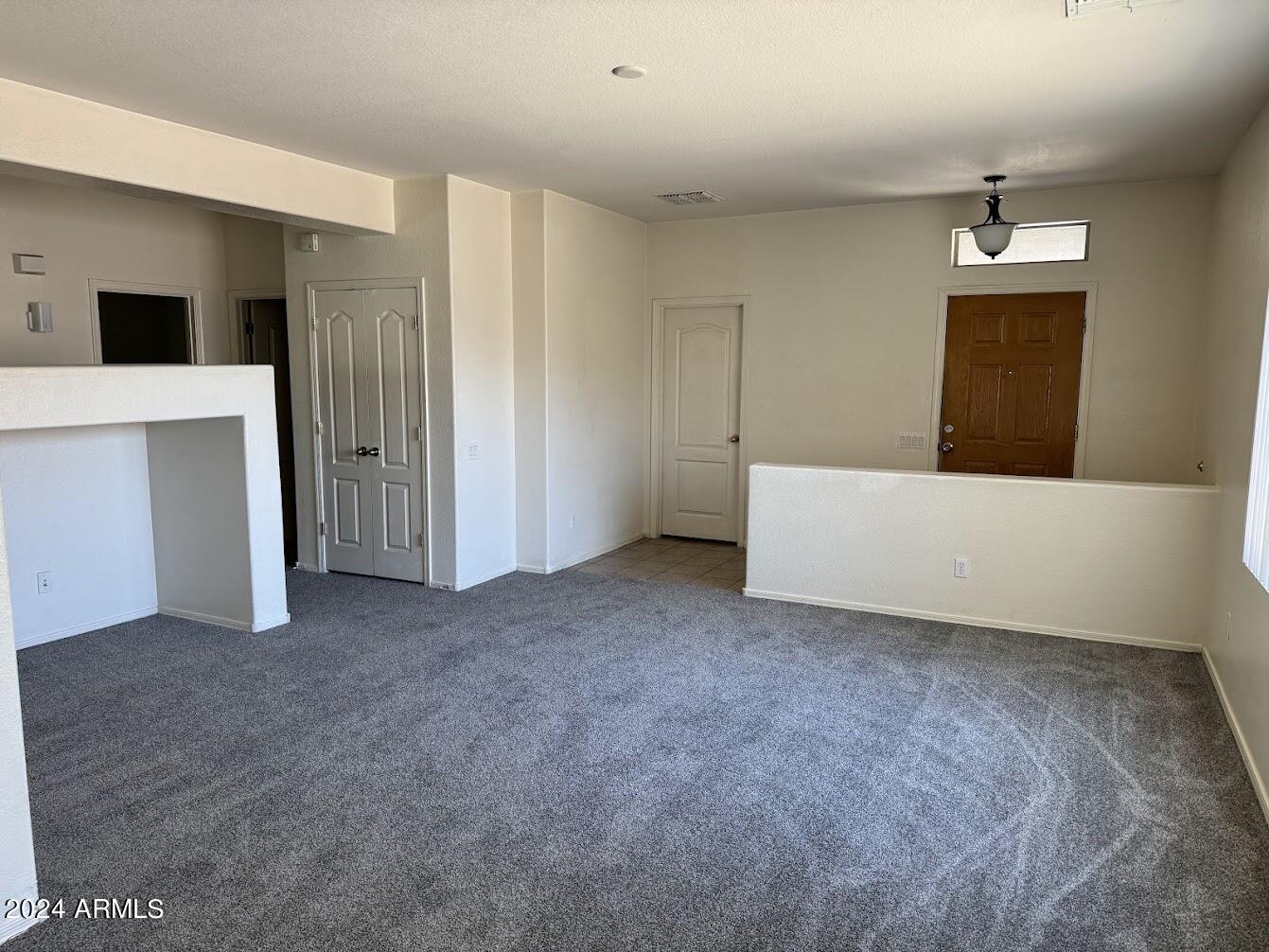 9401 West Berkeley Road Phoenix, AZ 85037 - Photo 10 of 27 a view of an empty room with a cabinet