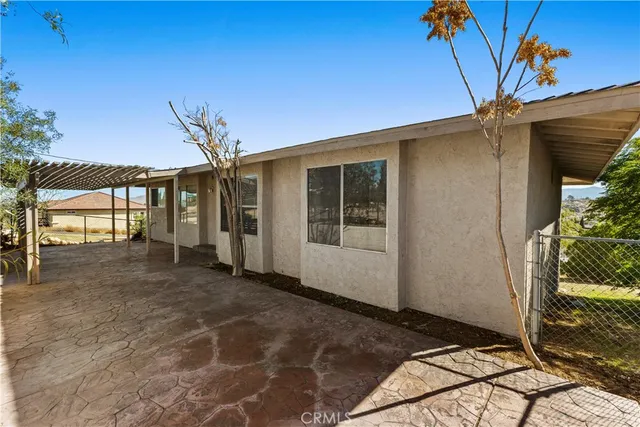 a view of balcony with wooden floor and seating space