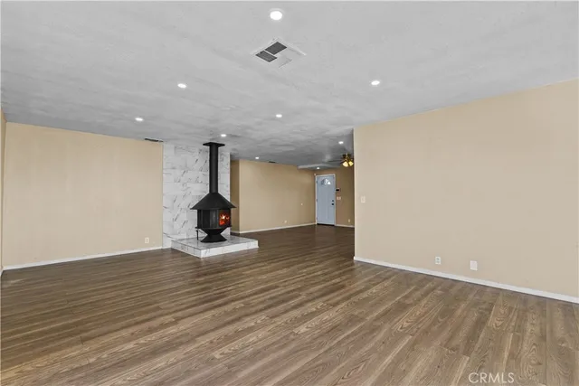 an aerial view of a house with a yard and sitting area