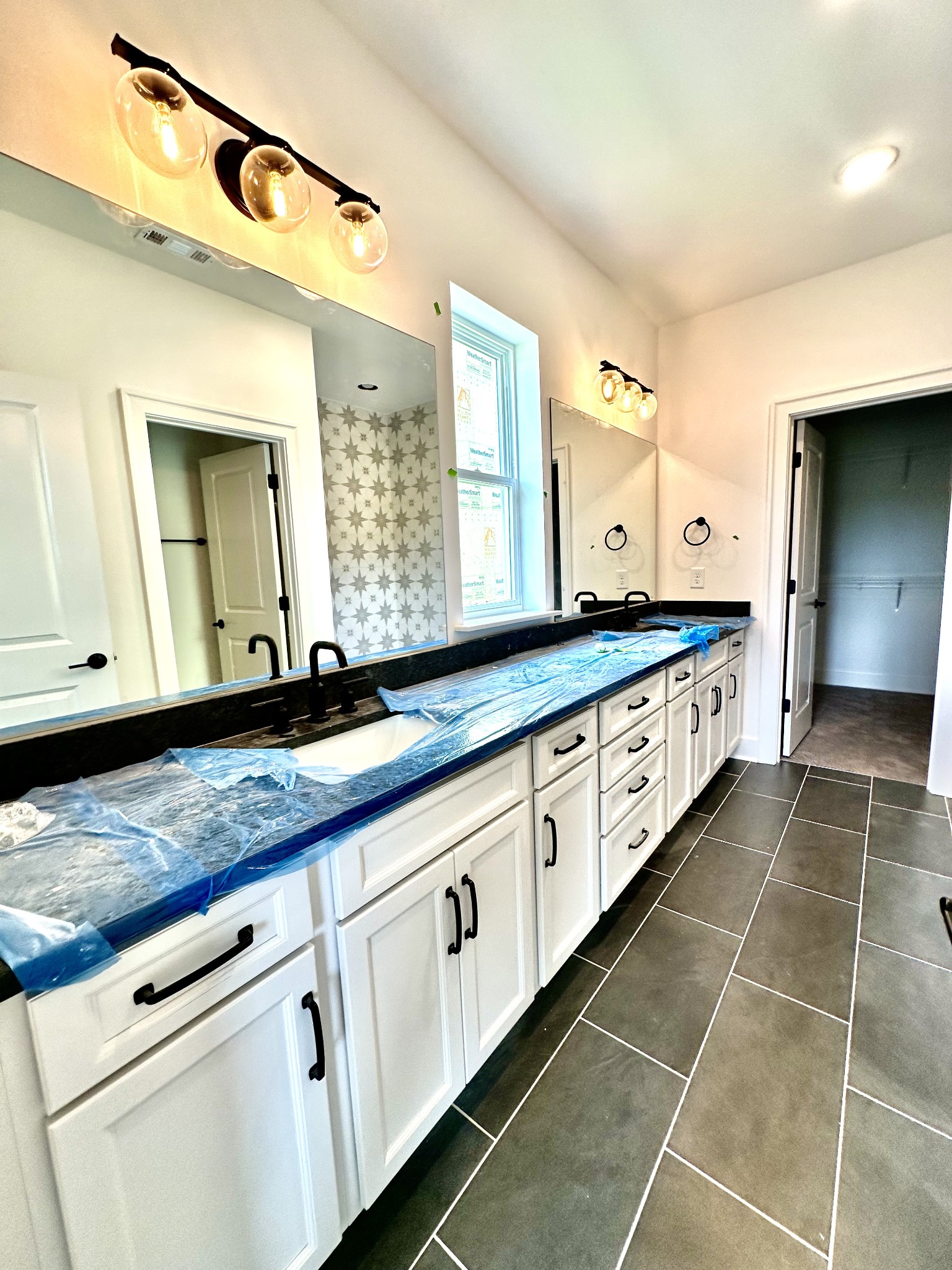 612 Whitetail Court Smyrna, TN 37167 - Photo 11 of 18 a bathroom with a granite countertop double vanity sink and a mirror