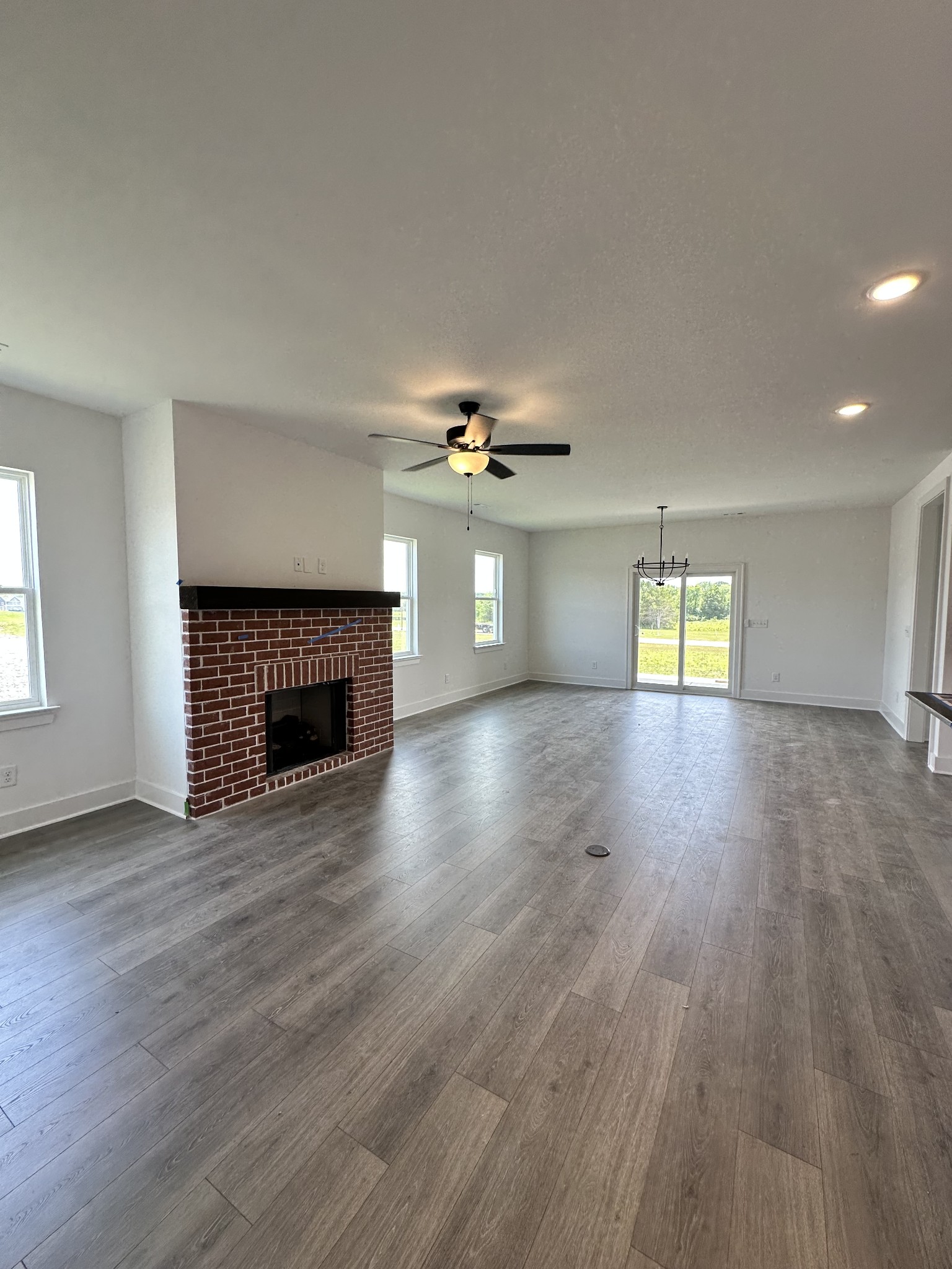 612 Whitetail Court Smyrna, TN 37167 - Photo 2 of 18 a view of an empty room with a fireplace and a window