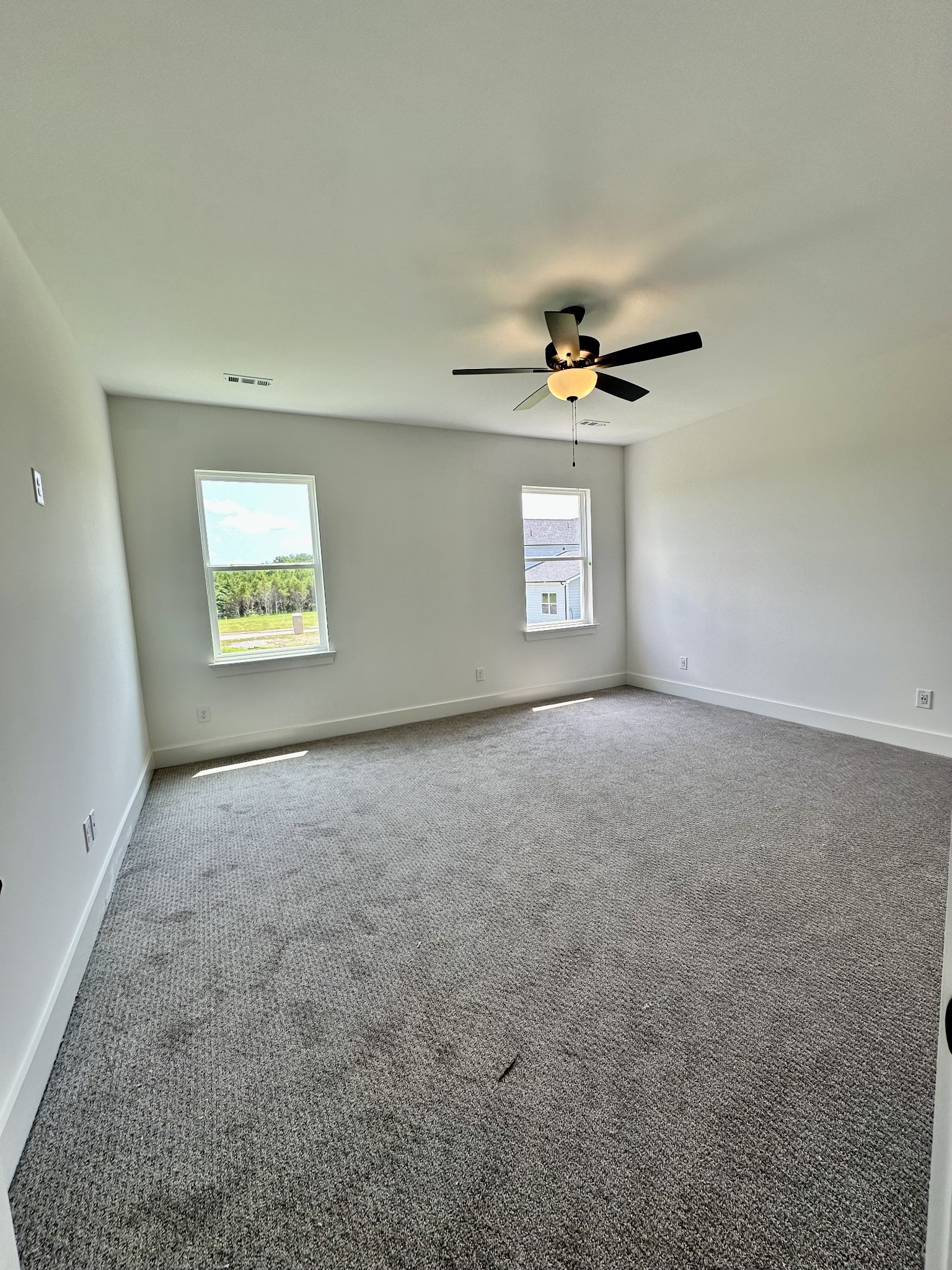 612 Whitetail Court Smyrna, TN 37167 - Photo 9 of 18 an empty room with windows and ceiling fan