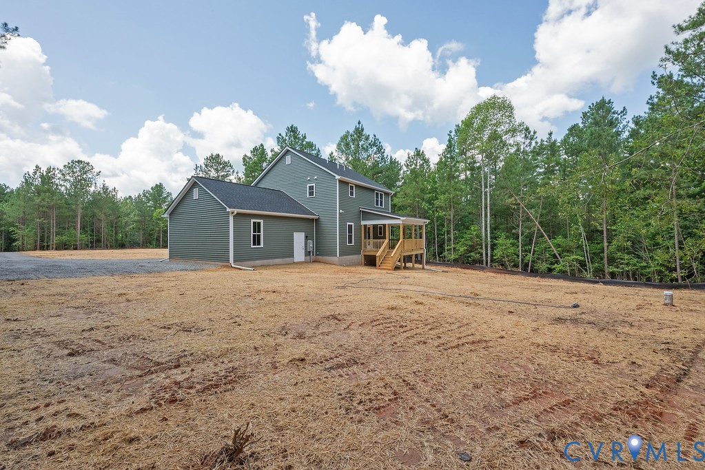 3844 Maidens Road Powhatan, VA 23139 - Photo 45 of 49 Rear view of house featuring a forest view and a d