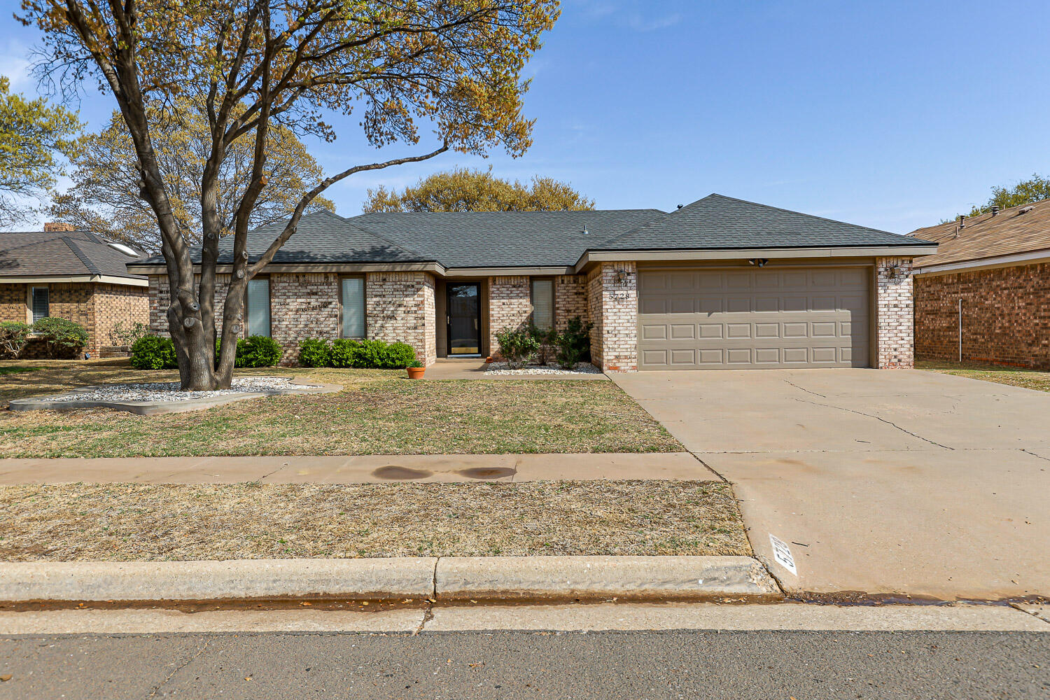 5728 92nd Street Lubbock, TX 79424 - Photo 1 of 40 front view of a house with a yard