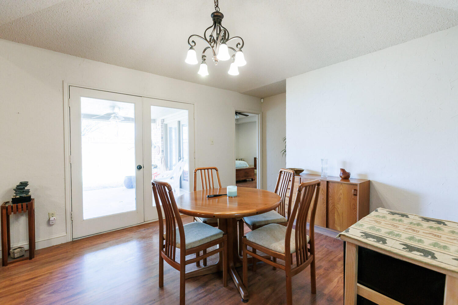 5728 92nd Street Lubbock, TX 79424 - Photo 13 of 40 a view of a dining room with furniture and wooden floor