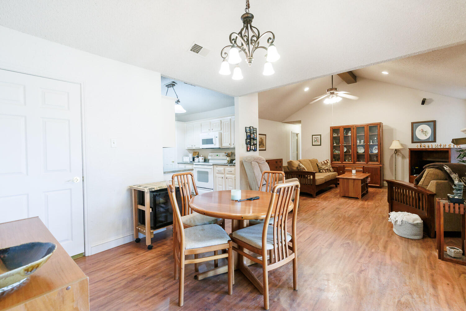 5728 92nd Street Lubbock, TX 79424 - Photo 14 of 40 a view of a dining room with furniture and wooden floor