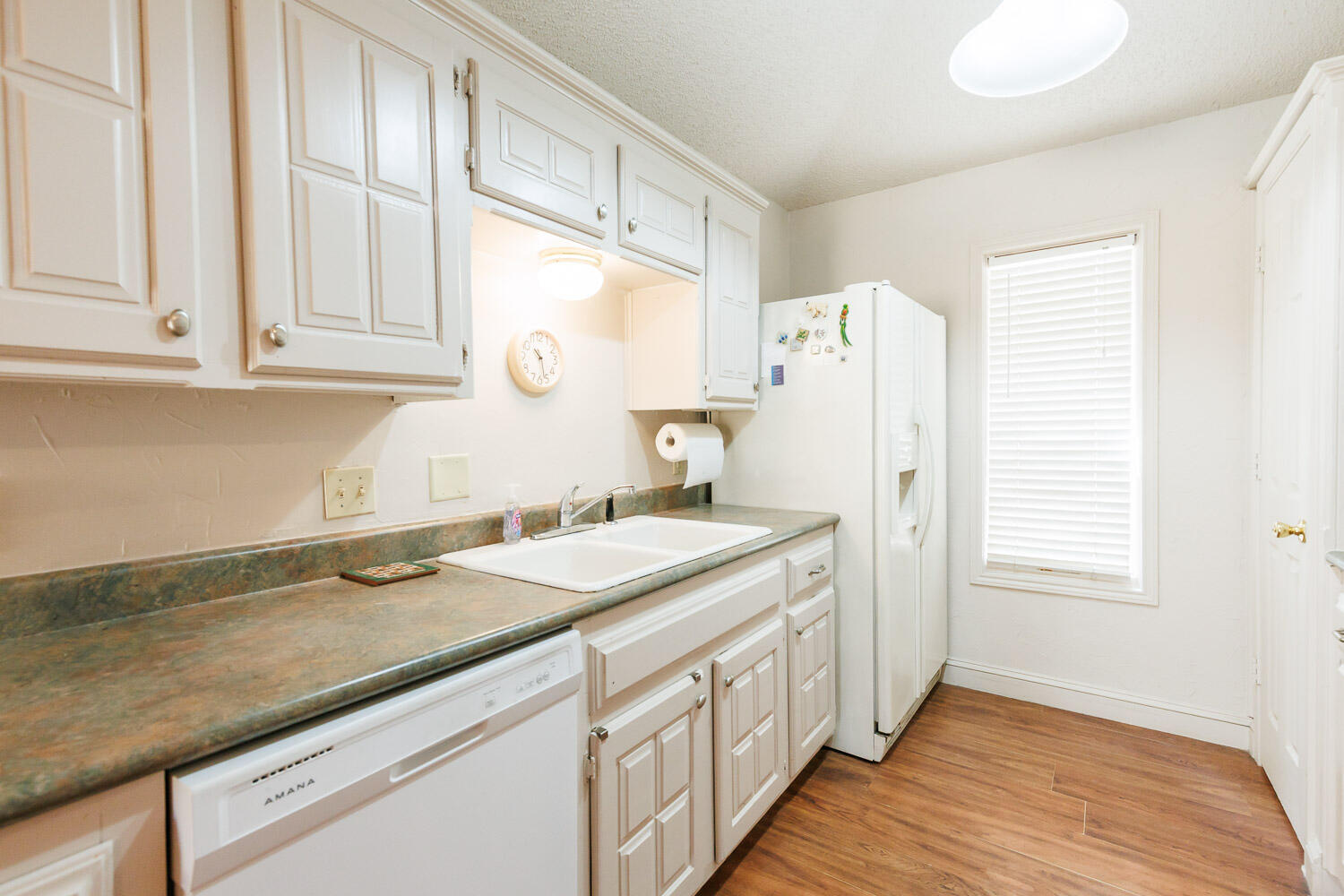 5728 92nd Street Lubbock, TX 79424 - Photo 17 of 40 a kitchen with a sink stove and refrigerator