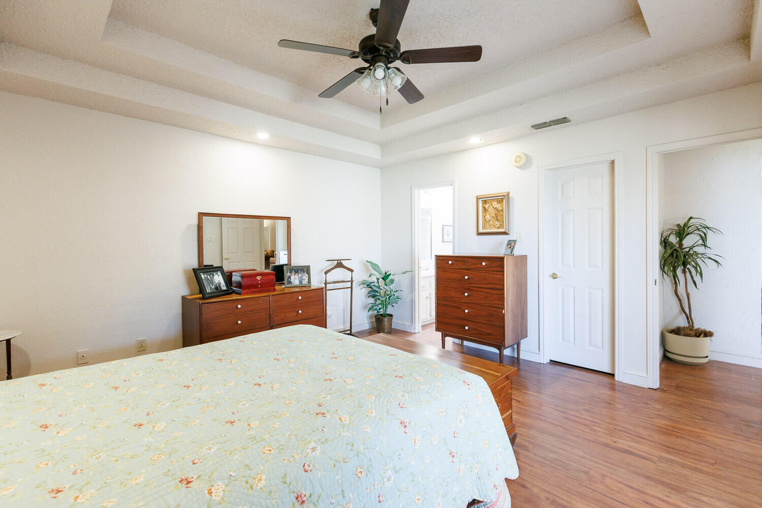5728 92nd Street Lubbock, TX 79424 - Photo 20 of 40 a bedroom with a bed and a chandelier