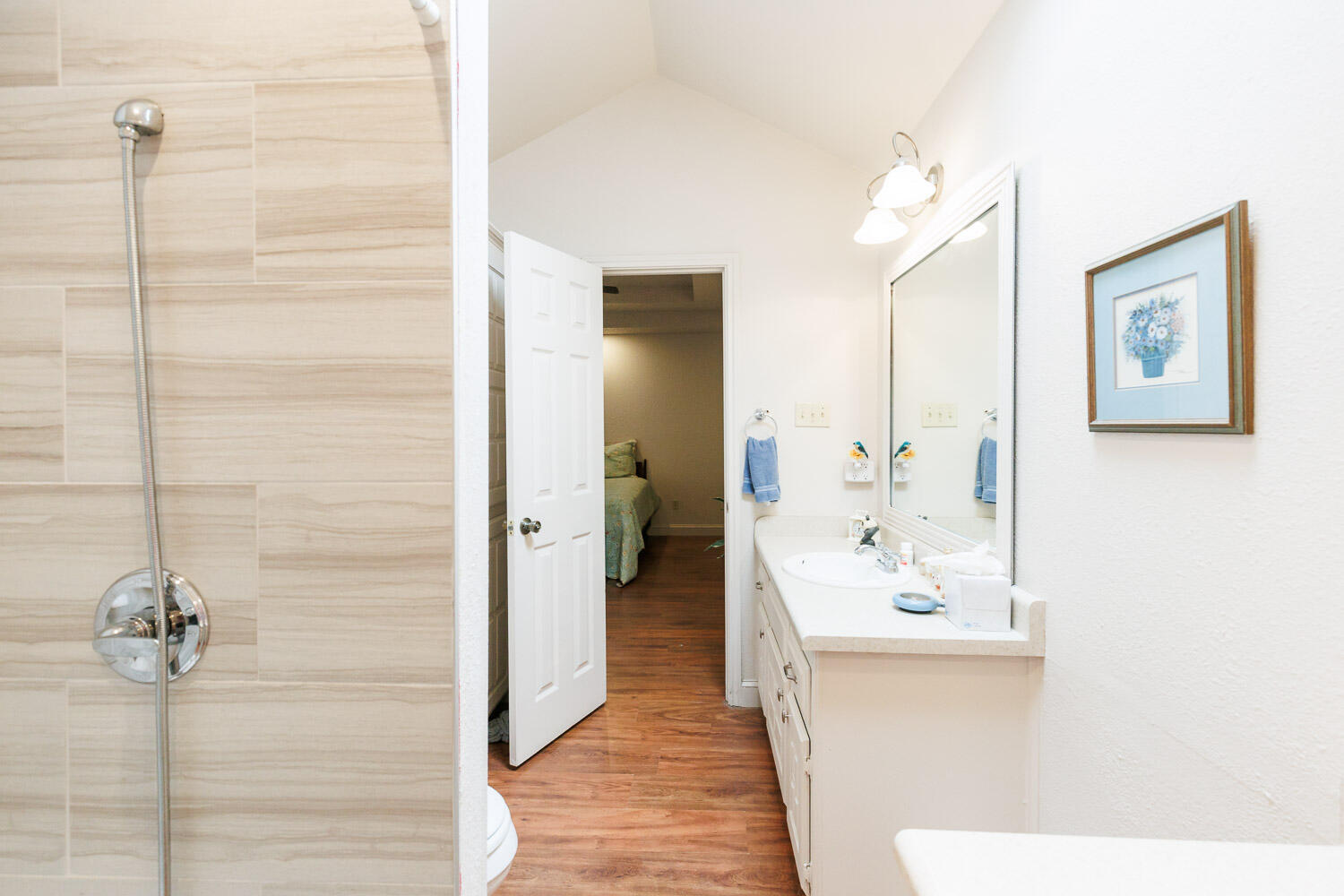 5728 92nd Street Lubbock, TX 79424 - Photo 24 of 40 a bathroom with a sink and a mirror