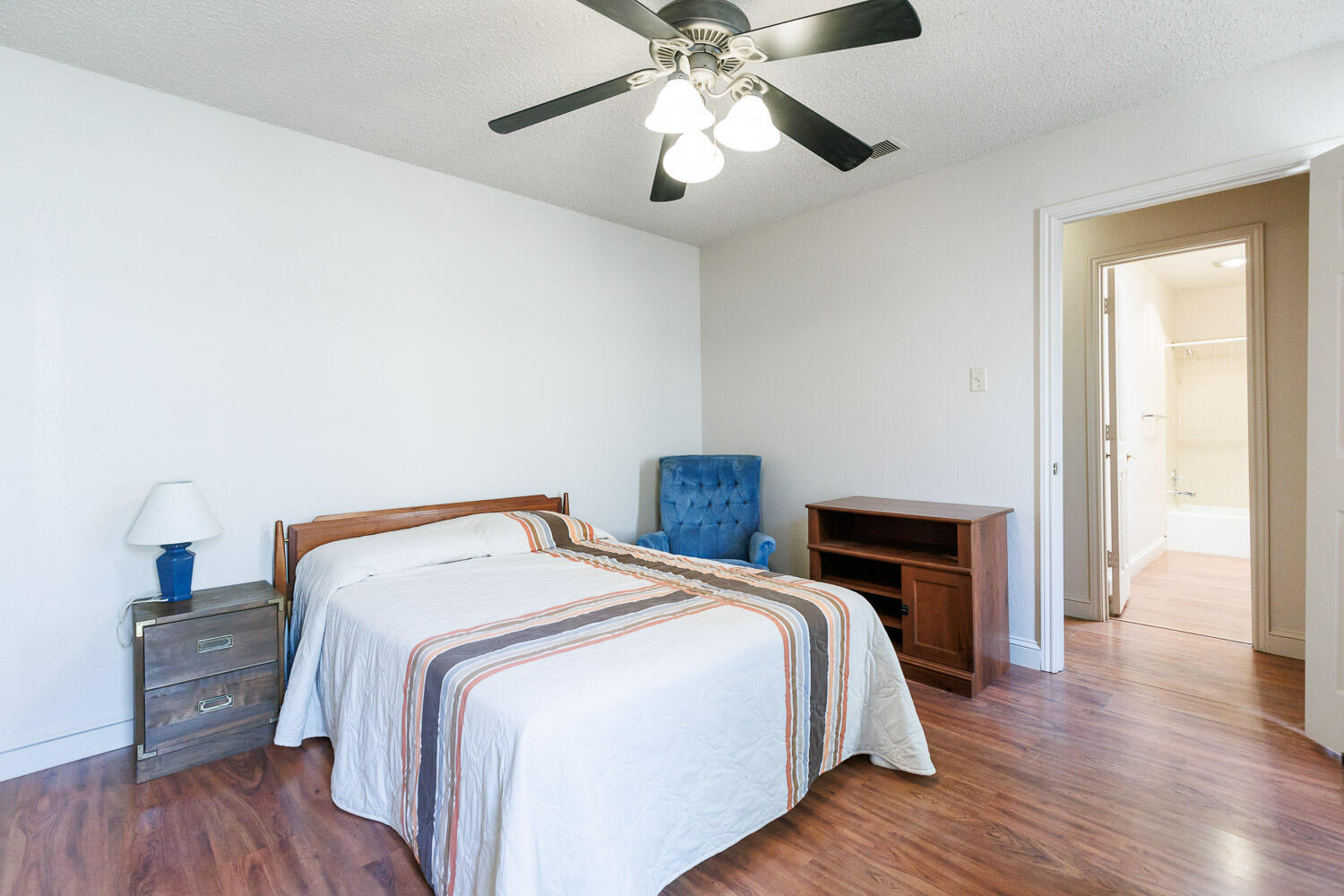 5728 92nd Street Lubbock, TX 79424 - Photo 25 of 40 a bedroom with a bed and wooden floor