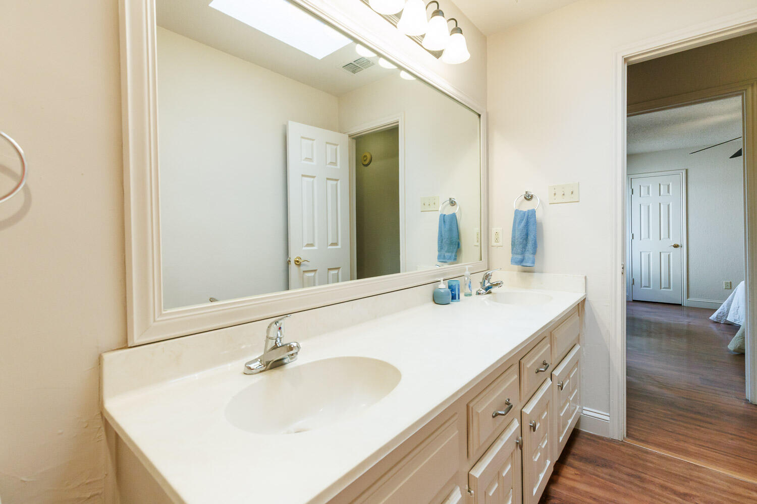 5728 92nd Street Lubbock, TX 79424 - Photo 28 of 40 a bathroom with a sink and a mirror