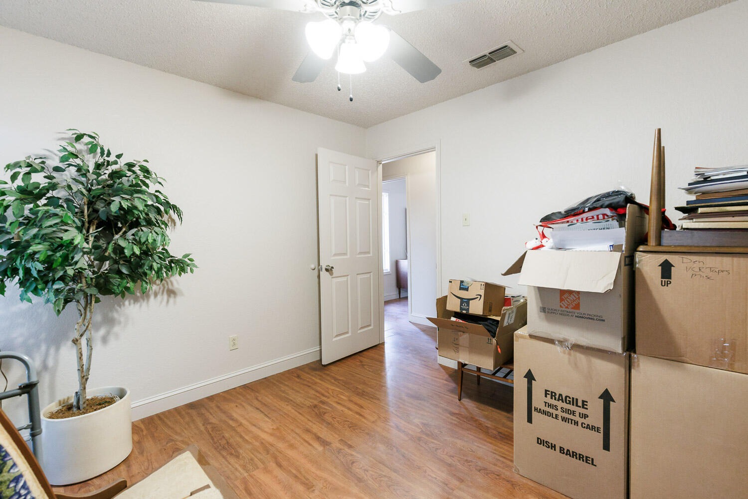 5728 92nd Street Lubbock, TX 79424 - Photo 29 of 40 a living room with furniture and a potted plant