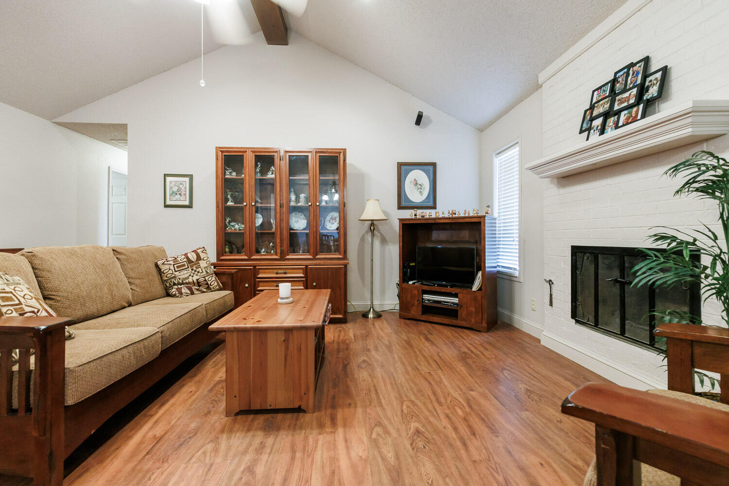 5728 92nd Street Lubbock, TX 79424 - Photo 3 of 40 a living room with furniture and a flat screen tv