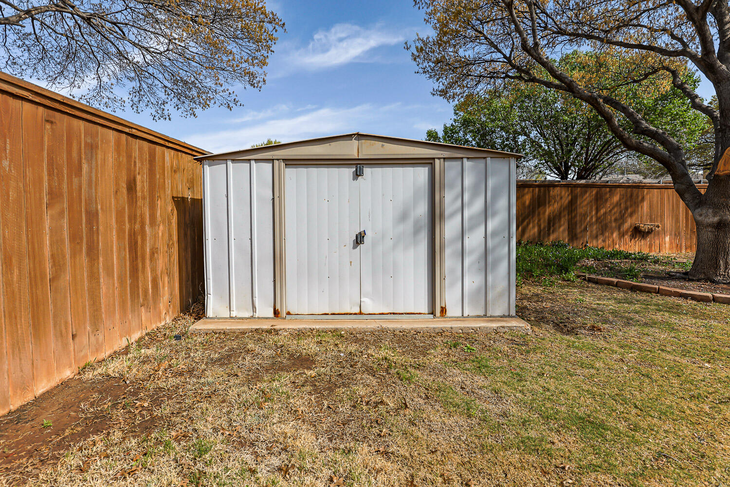 5728 92nd Street Lubbock, TX 79424 - Photo 40 of 40 a view of a backyard with potted plants