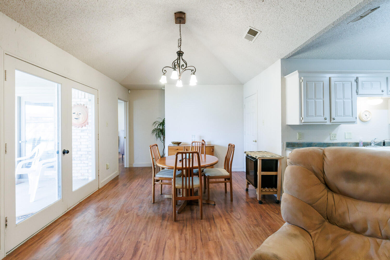 5728 92nd Street Lubbock, TX 79424 - Photo 4 of 40 a view of a livingroom with furniture and wooden floor