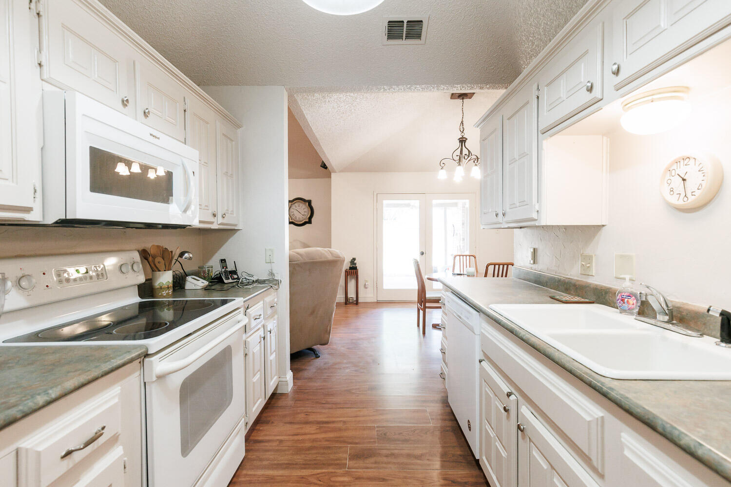 5728 92nd Street Lubbock, TX 79424 - Photo 5 of 40 a kitchen with a sink stove and cabinets
