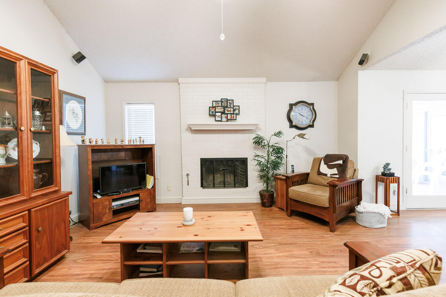 5728 92nd Street Lubbock, TX 79424 - Photo 10 of 40 a living room with furniture and a fireplace