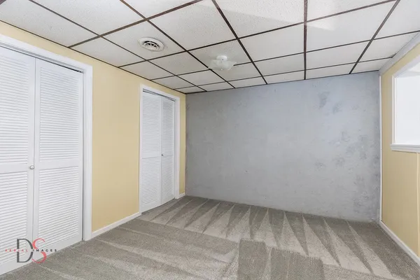 a view of a room with a white walls and roof