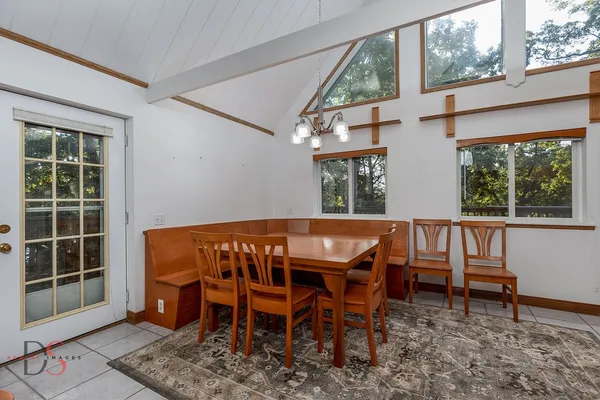 a view of a dining room with furniture window and outside view