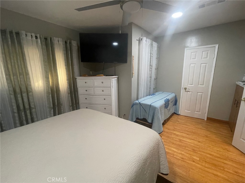 26326 Investors Hemet, CA 92544 - Photo 16 of 46 a bedroom with a bed and a dresser