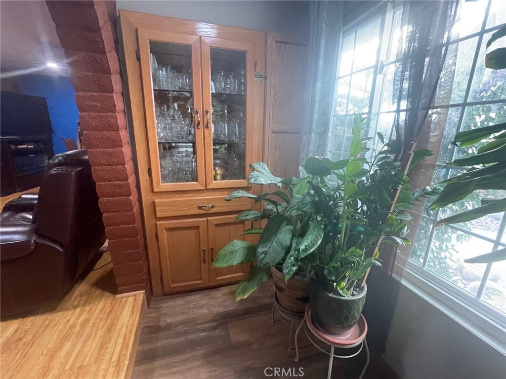26326 Investors Hemet, CA 92544 - Photo 18 of 46 a room with a chair and potted plant