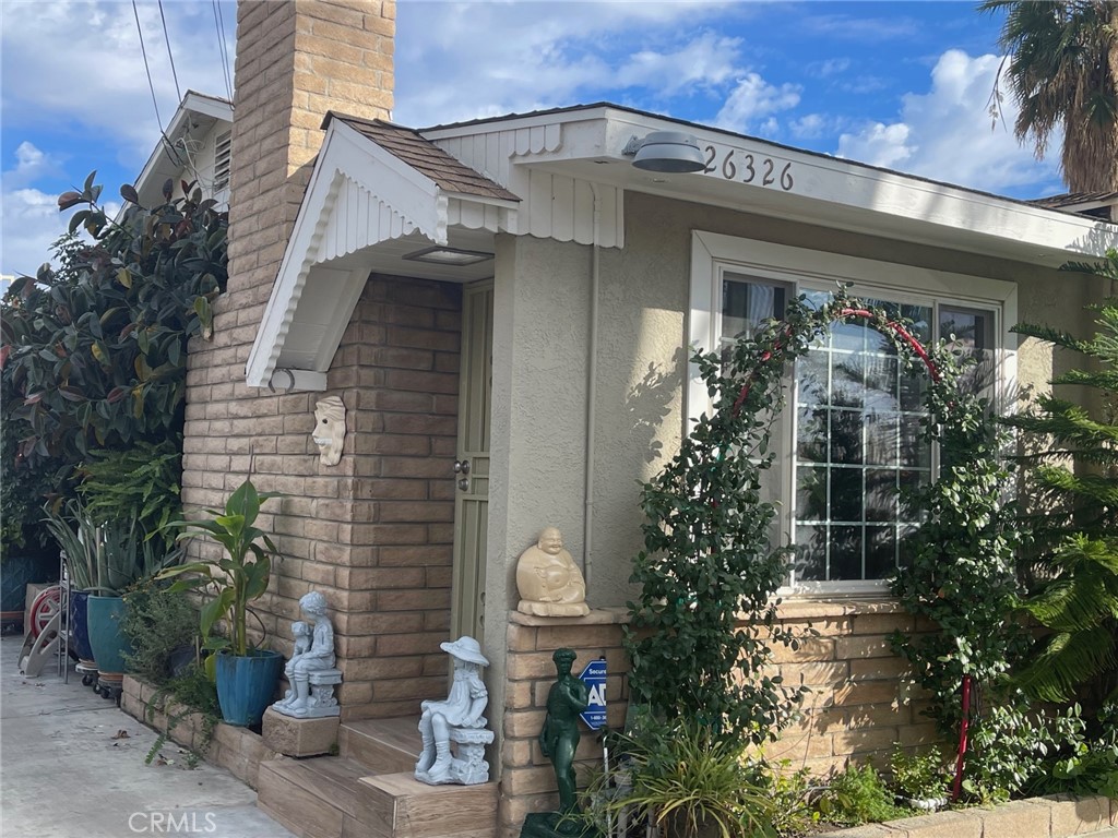 26326 Investors Hemet, CA 92544 - Photo 2 of 46 a front view of a house